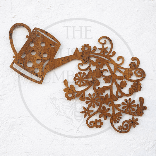 Metal Flowers Falling From Watering Can