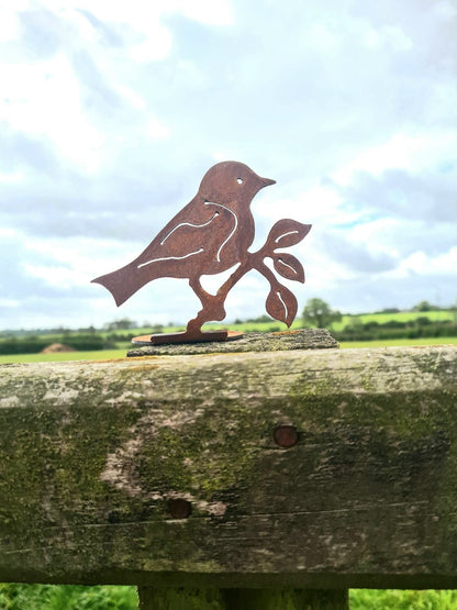 Rusted Metal Bird on Branch