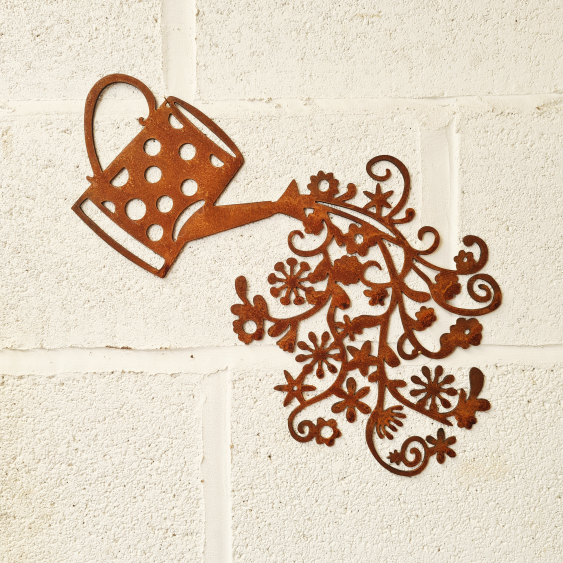 Metal Flowers Falling From Watering Can