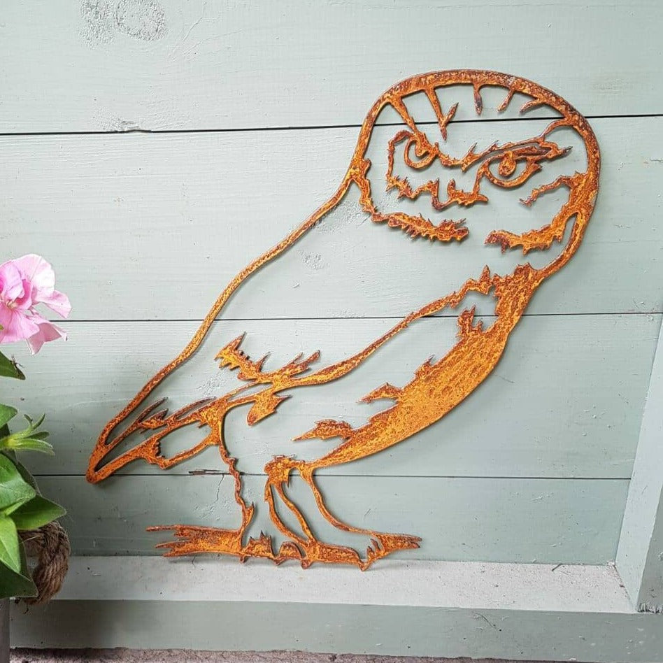 Rusted Metal Owl on branch
