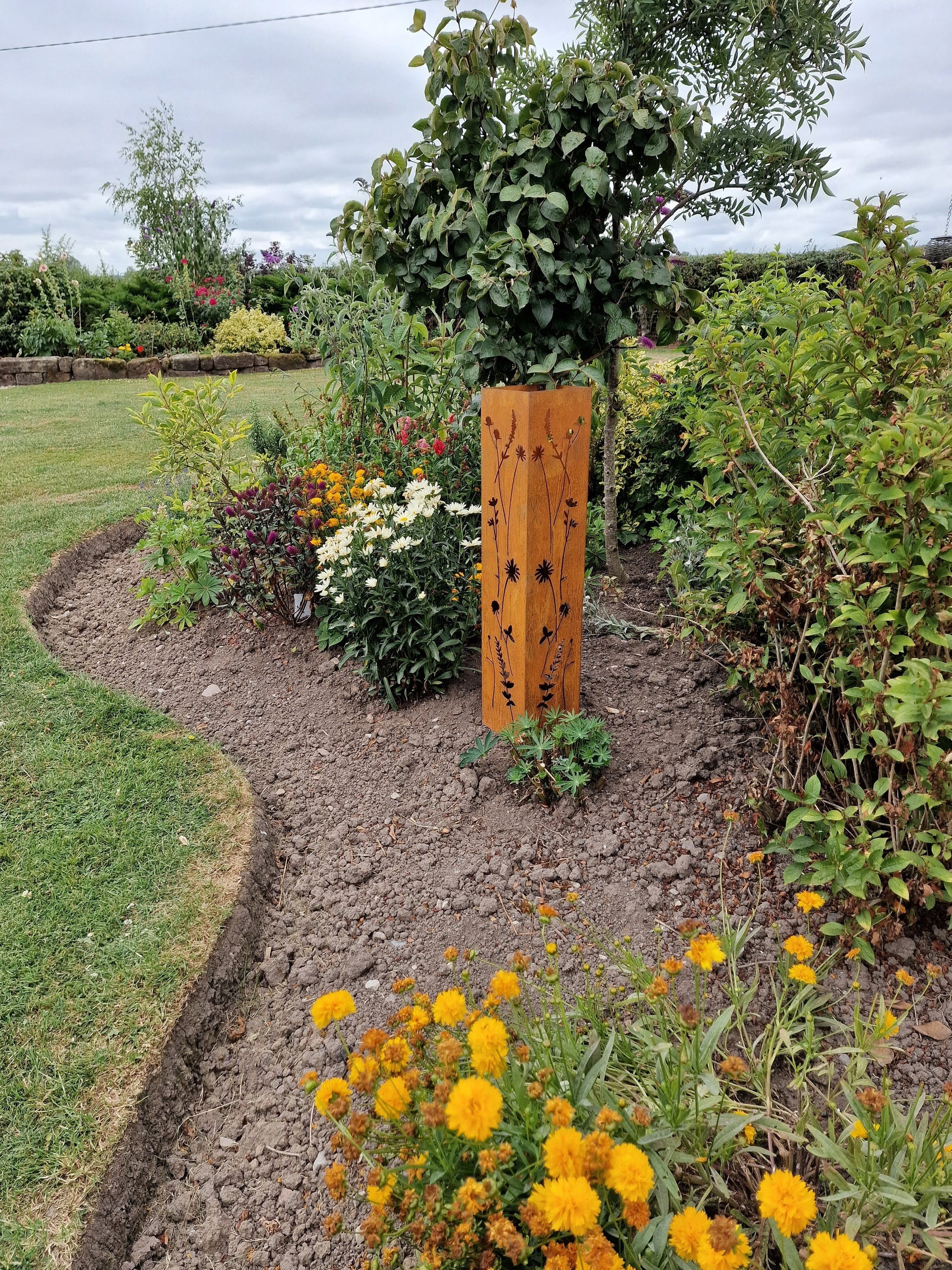 Rusted Metal Wildflower Oblong Statue