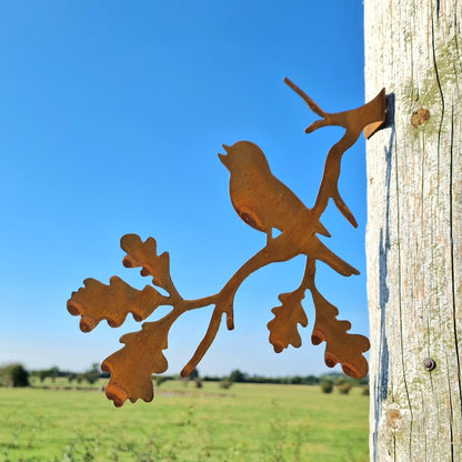 Rusted Metal Robin Singing On a Branch