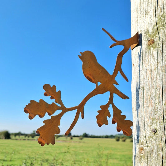 Rusted Metal Robin Singing On a Branch